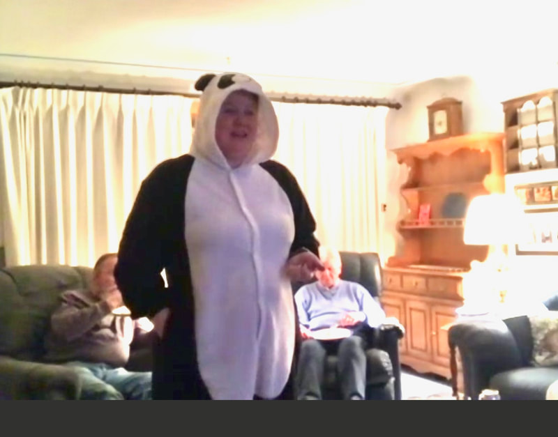 woman on screen in panda costume.