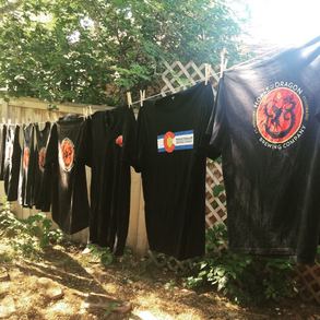 H&D tshirts hanging on a clothes line.