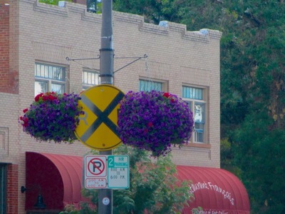 Flowers and railroad crossing sign in Old Town.