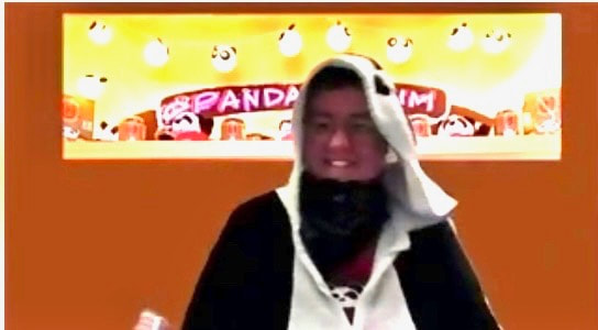 Woman on screen in panda onesie