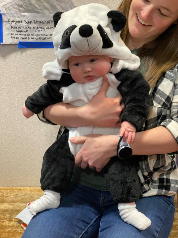baby in panda costume.