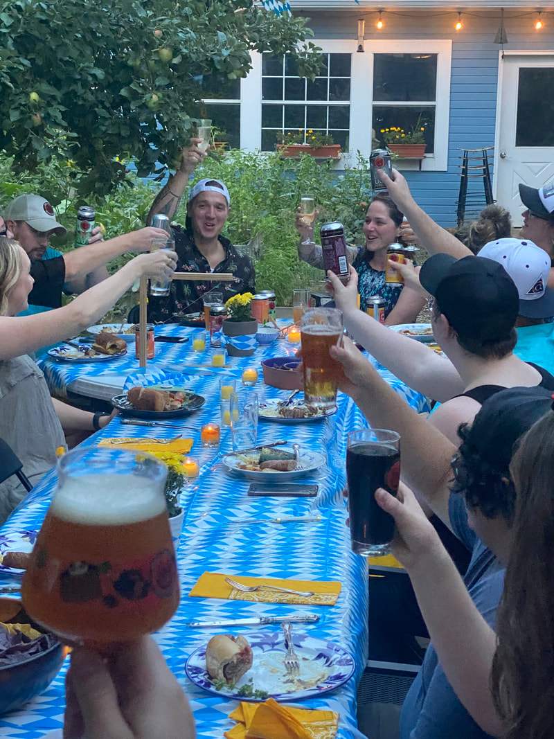 people cheersing over a long table
