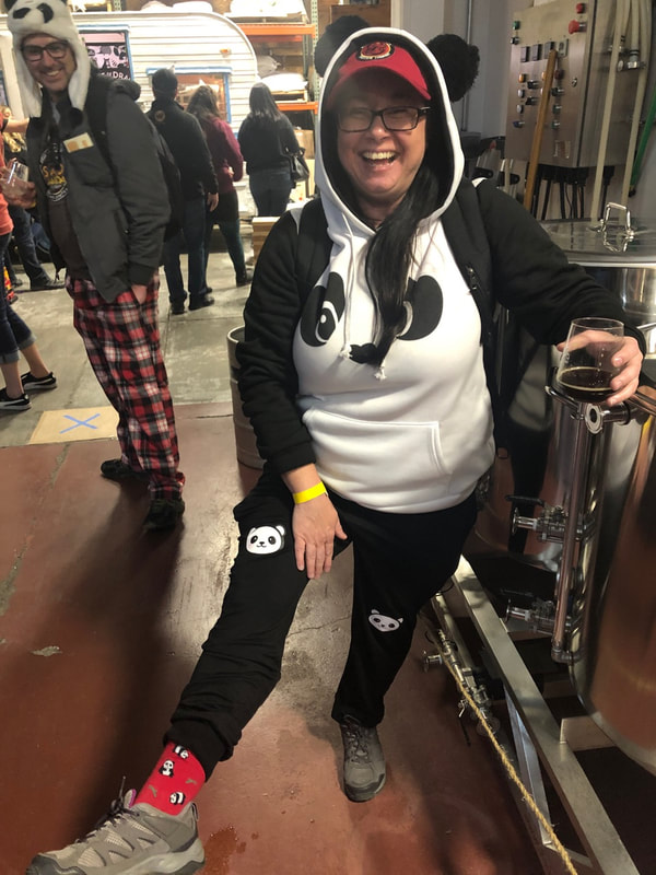 woman in a panda costume.