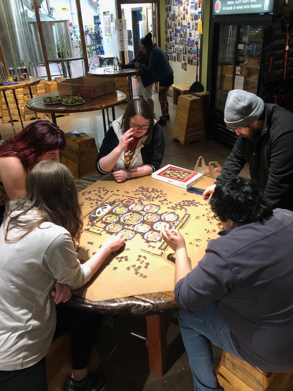 People working on the puzzle.